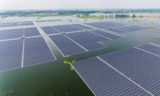 Just as Donald Trump was pulling the United States out of the Paris Accord on climate change, China was opening the world's biggest floating solar farm - AFP