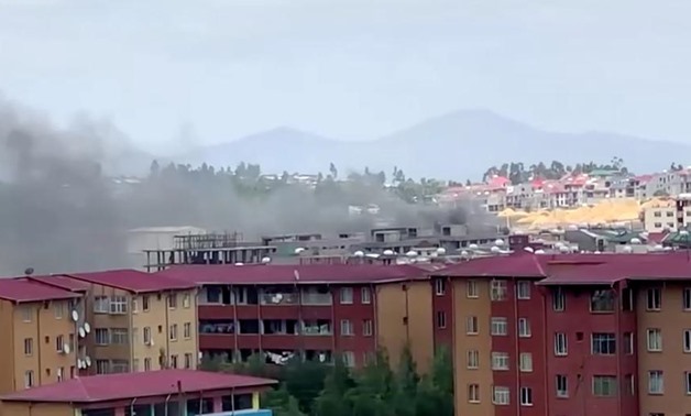 Smoke rises over Addis Ababa skyline during protests following the fatal shooting of the Ethiopian musician Haacaaluu Hundeessaa, in Addis Ababa, Ethiopia June 30, 2020, in this screengrab taken from a video. Picture taken June 30, 2020. REUTERS/Stringer