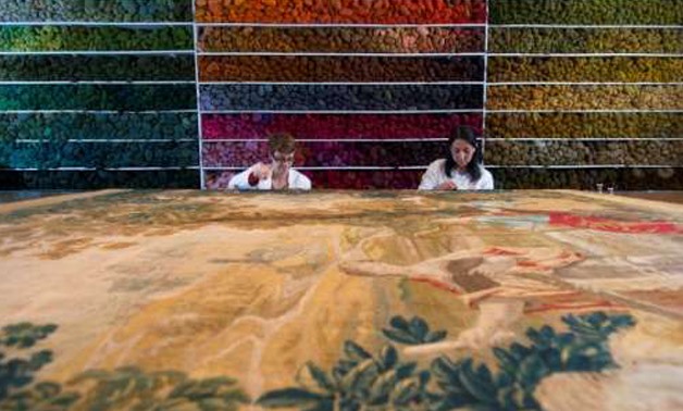 Specialists work at the Royal Manufacturers De Wit in Belgium currently the world's biggest restorer of old tapestries


