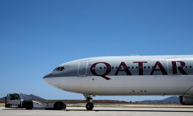FILE PHOTO - A Qatar Airways aircraft is seen at a runway of the Eleftherios Venizelos International Airport in Athens, Greece, May 16, 2016 - REUTERS
