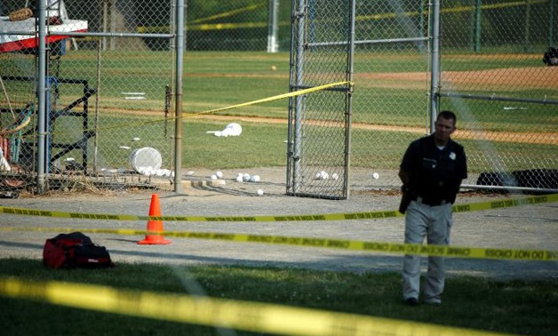A police officer mans a shooting scene after a gunman opened fire on Republican members of Congress during a baseball practice near Washington in Alexandria, Virginia, June 14, 2017 - REUTERS