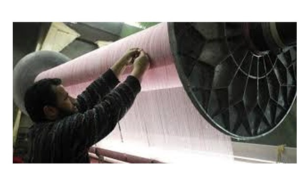 A Laborer works at a textile mill in Mahalla el-Kubra indistrial complex - Reuters