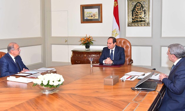 President Abdel Fatah al-Sisi meeting with Finance Minister Amr El-Garhy and Prime Minister Sherif Ismail - courtesy presidential media office