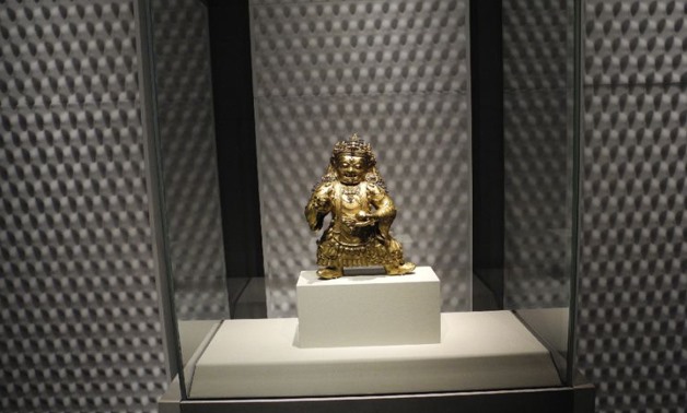 A 15th-century Tibetan statue is part of an exhibit in New York that explores the nature of sound and its relationship to the quest to under the cosmos (AFP Photo/Andrew CABALLERO-REYNOLDS)