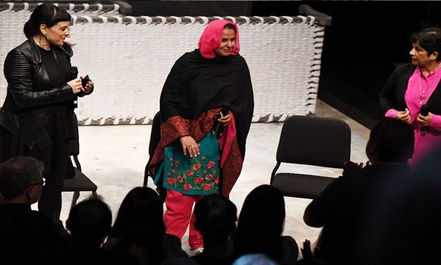 Pakistani human rights activist Mukhtar Mai (C) receives a standing ovation as she takes the stage following performance of the opera 'Thumbprint', at the Roy and Edna Disney/Calarts Theater (REDCAT) in Los Angeles, on June 16, 2017 (AFP Photo/Robyn Beck)