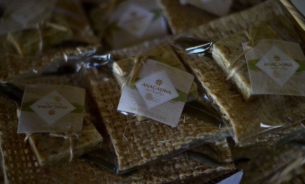 
A Haitian program to recycle used soap bars from luxury hotels has proven a win-win-win proposition - AFP