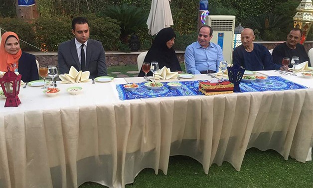 President Sisi talks with an elderly woman during the iftar- Mohamed el-Gali