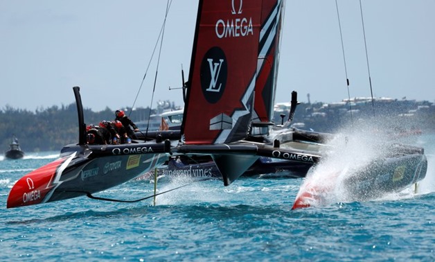 Emirates Team New Zealand crosses finish line to win race two over Oracle Team USA in America's Cup Finals.  REUTERS