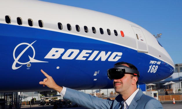 Maziar Farzam, President of Inhance Digital, demonstrates virtual reality glasses which provide digital information about the Boeing 787-10 aircraft, during the opening of the 52nd Paris Air Show at Le Bourget Airport - REUTERS/Pascal Rossignol
