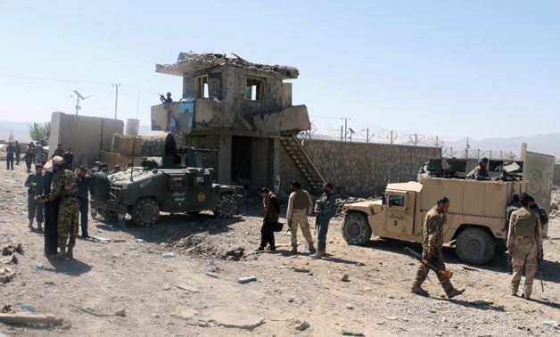 Afghan security forces inspect the aftermath of suicide bomb blast in Gardez - Reueters
