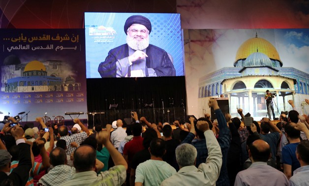 Lebanon's Hezbollah leader Sayyed Hassan Nasrallah addresses his supporters via a screen during a rally marking Al-Quds day in Beirut's southern suburbs, Lebanon June 23, 2017. REUTERS