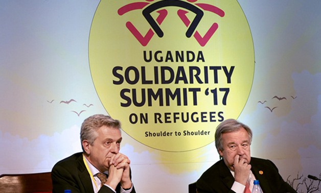 UN High Commissioner for Refugees, Filippo Grandi (L) and UN Secretary General, Antonio Guterres (R) take part in a fundraising summit on June 23, 2017 in Kampala. AFP Photo / Michael O'hagan