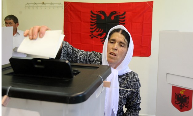 A woman casts her vote during the parliamentary election in Surel near Tirana, Albania June 25, 2017. REUTERS/Florion Goga