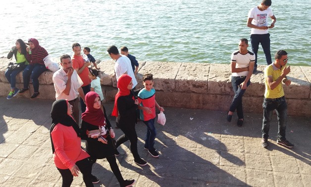 People walking along the beach in Alexandria – Egypt Today/Noha Ragab