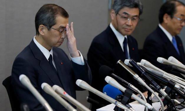 Takata Corp. Chairman and CEO Shigehisa Takada (L) and company senior officials attends a news conference after its decision to file for bankruptcy protection in Tokyo, Japan, REUTERS/Toru Hanai

