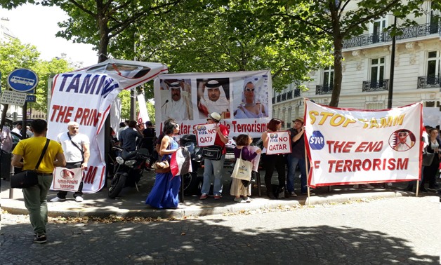 Number of protesters calling for the French government not to receive the Qatari Emir in France Press Photo
