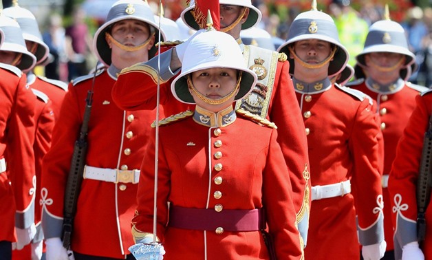 Captain Megan Couto (C) of the 2nd Battalion, Princess Patricia's Canadian Light Infantry (PPCLI) leads her battalion to makes history as the first female infantry officer to command the Queen's Guard at Buckingham Palace in central London on June 26, 201