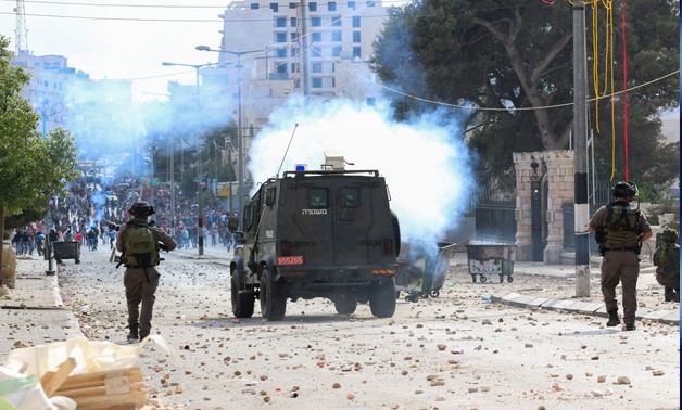 Palestinian youth clash with Israeli troops in Bethlehem following the funeral of a 13-year CC