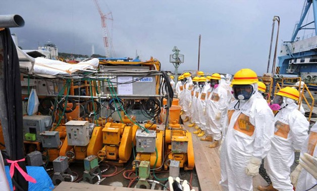 Japanese government officials and nuclear experts inspecting a facility to prevent seeping of contamination water into the sea at Tokyo Electric Power's (TEPCO) Fukushima Dai-ichi nuclear plant in Okuma, Fukushima prefecture on August 6, 2013. FILE PHOTO 