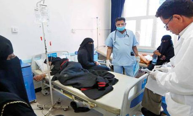 Yemenis suspected of being infected with cholera receive treatment at a hospital in Sanaa (AFP)