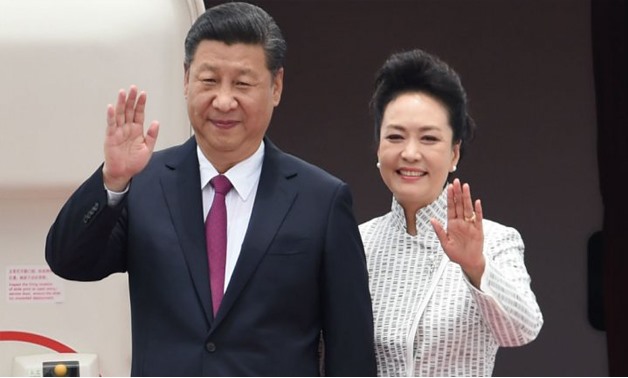 Anthony Wallace, AFP | China's President Xi Jinping and his wife Peng Liyuan arrive at Hong Kong's international airport on June 29, 2017.
