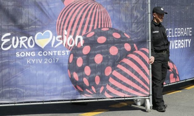 A policeman stands next to an entrance to the Eurovision Village, an official fan zone for the Eurovision Song Contest 2017 - REUTERS/Valentyn Ogirenko