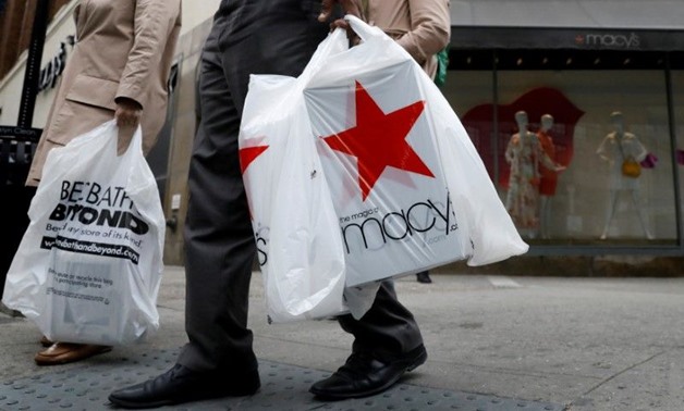 A customer exits after shopping at a Macy’s store in the Brooklyn borough of New York on May 11, 2017. — Reuters pic