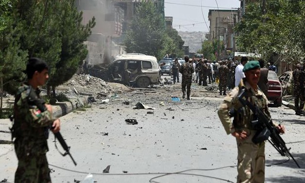 Afghan security forces stand alert at the site of a bomb blast that targeted NATO forces in Kabul, Afghanistan, on July 7, 2015. (© AFP)