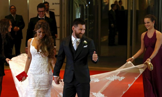 Argentine soccer player Lionel Messi and his wife Antonela Roccuzzo make an appearance for the press at their wedding in Rosario, Argentina.JPG