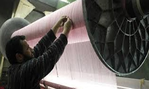 A Laborer works at a textile mill in Mahalla el-Kubra indistrial complex - Reuters
