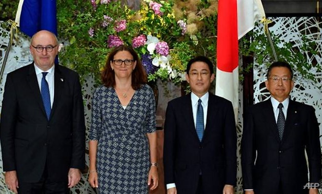 EU and Japanese top officials pose before their working dinner as a part of the Japan-EU Economic Partnership Agreement negotiations at Iikura guest house in Tokyo on Jun 30. (Photo: AFP/Franck Robichon)
