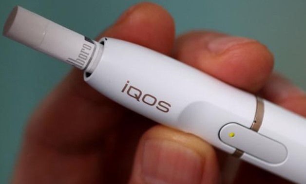 A man uses a Philip Morris iQOS e-cigarette -  REUTERS/Issei Kato