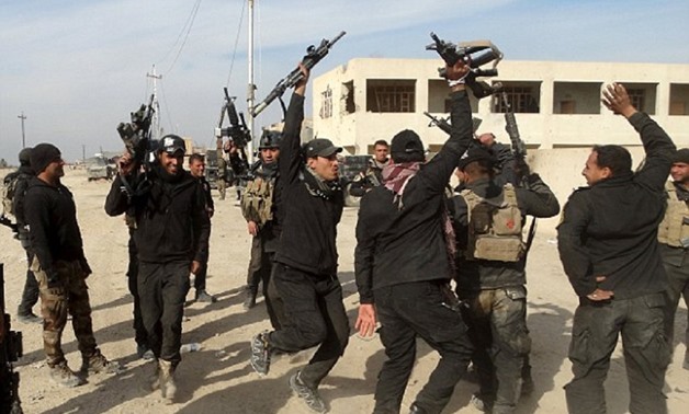 Iraqi forces celebrate after retaking the city of Ramadi from ISIS, and could now go (Reuters)