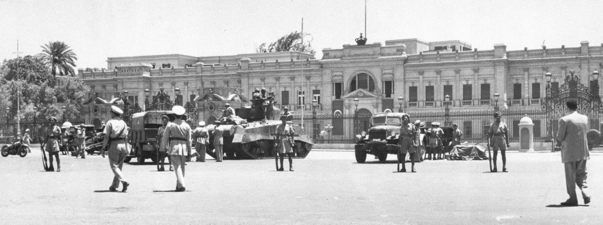 July 26, 1952, An Egyptian army tank and field guns are drawn up in front of the Abdin Palace in Cairo. Inside the palace, King Farouk agrees to abdicate in favor of his 7-month-old son, Prince Fuad.