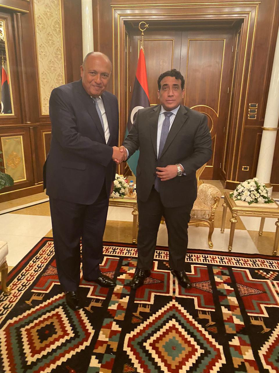 Head of the Libyan Presidential Council Mohamed al-Manfy (r) and Minister of Foreign Affairs Sameh Shokry in Tripoli on October 21, 2021. Press Photo