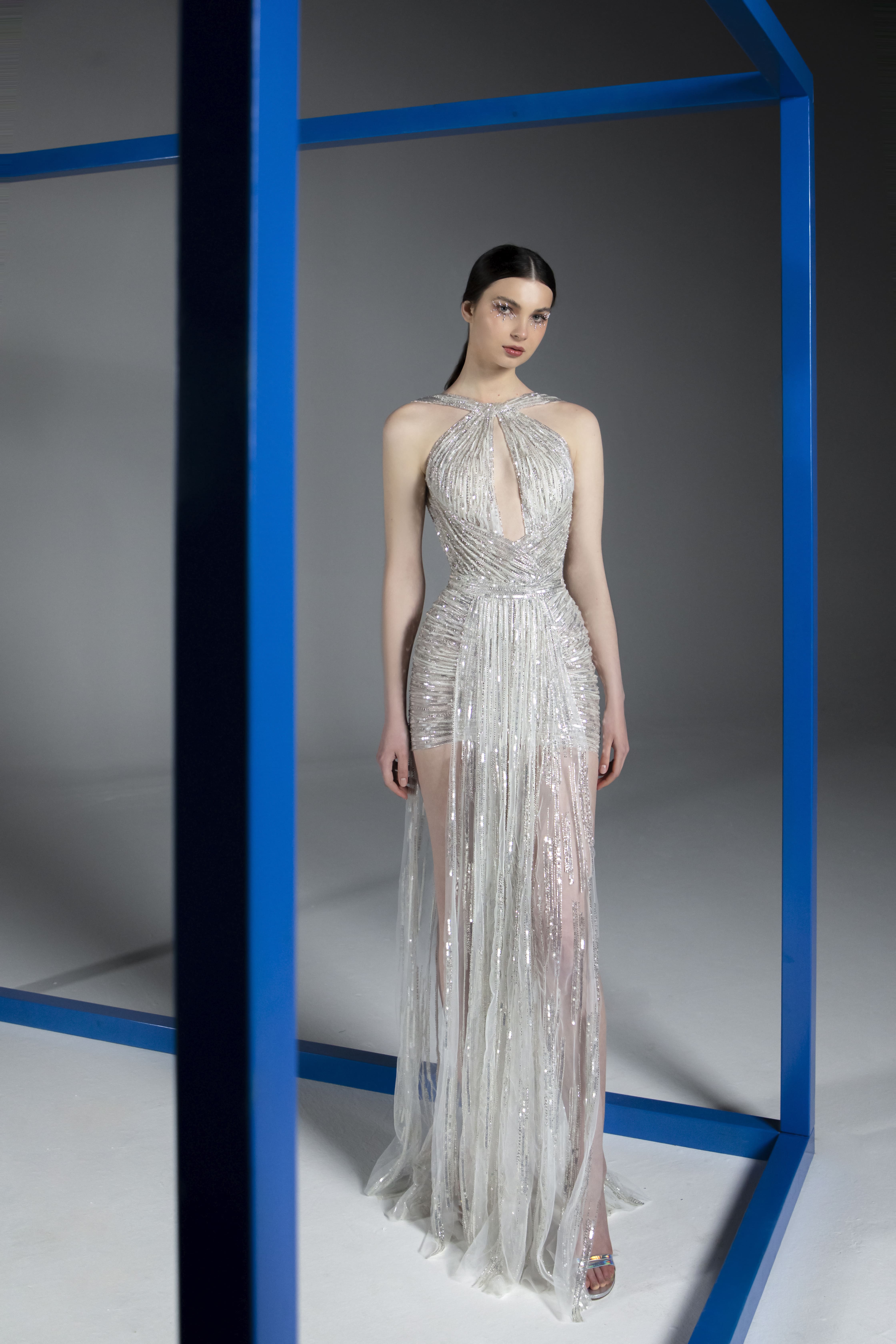 SS21-7 Silver draped gown embroidered with sequins, cut beads and swarovski crystals featuring a plunging necklinee-min