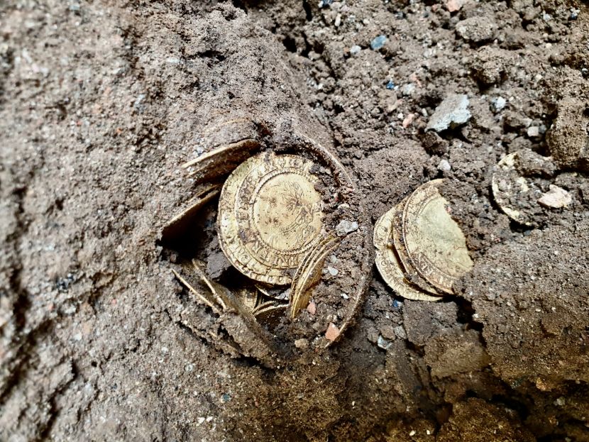 The coin hoard in situ. The couple were putting a new floor in when they made the find.Credit: Spink