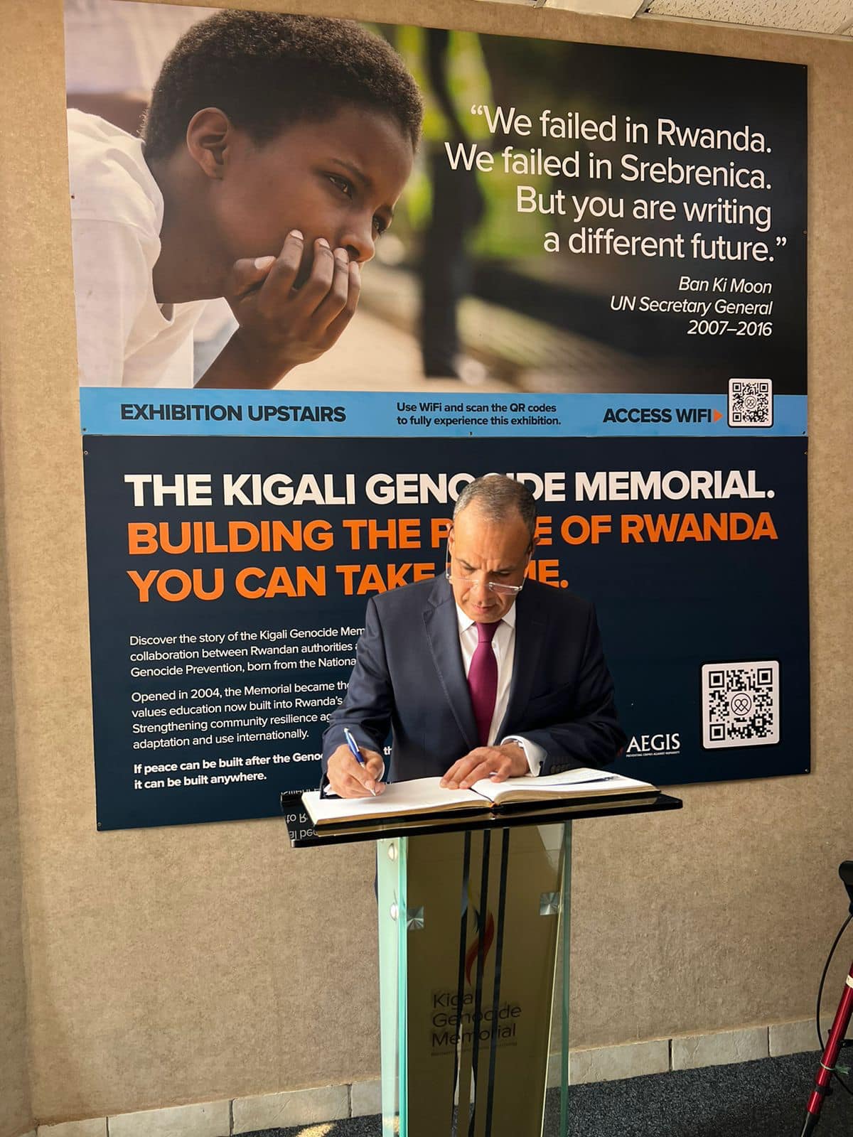 Abdelatty writes in the genocide memorial in Kigali Abdelatty writes in the genocide memorial in Kigali
