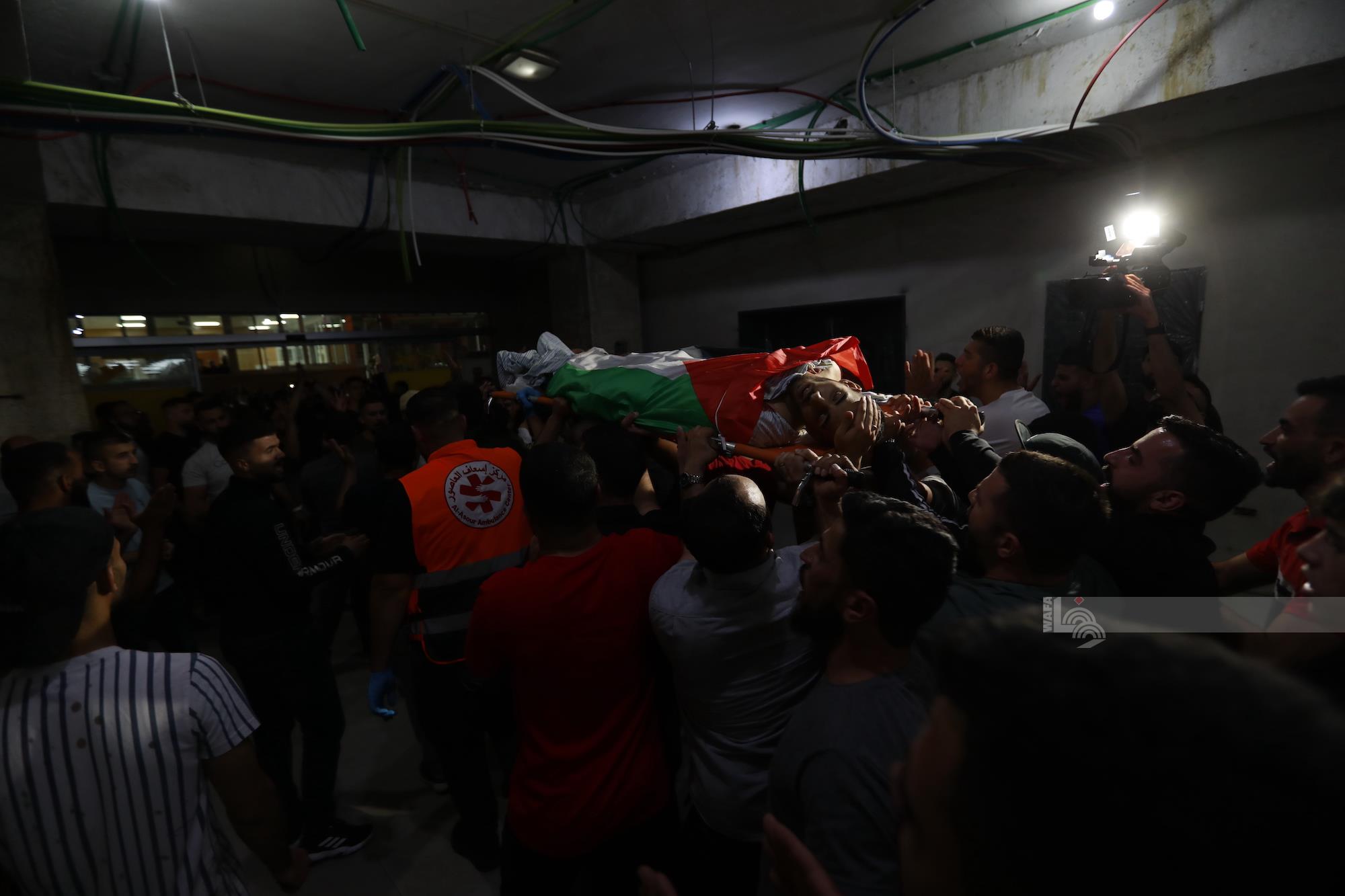 Crowds of people bids farewell for the three victims ahead of leaving them at their final resting place WAFA