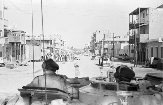 Jan.-20-1952-A-British-tank-crew-stands-by-as-troops-search-for-gu Jan.-20-1952-A-British-tank-crew-stands-by-as-troops-search-for-gu