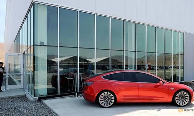 A prototype of the Tesla Model 3 is on display in front of the factory during a media tour of the Tesla Gigafactory in Sparks, Nevada. (REUTERS/James Glover II/File Photo)

Read more at http://www.channelnewsasia.com/news/business/tesla-s-lower-priced-m