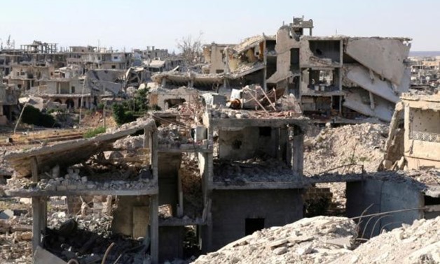 FILE PHOTO: A general view shows damaged buildings in a rebel-held part of the southern city of Deraa, Syria June 22, 2017. REUTERS/Alaa Al-Faqir/File Photo