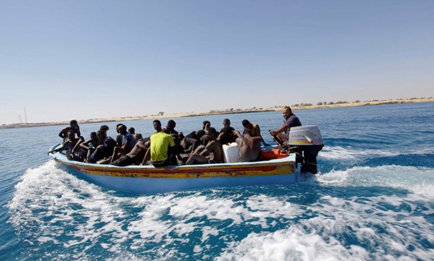 Migrants ride in a boat after they were rescued by Libyan coastguard off the coast of Gharaboli, east of Tripoli, Libya July 8, 2017. REUTERS/Ismail Zitouny