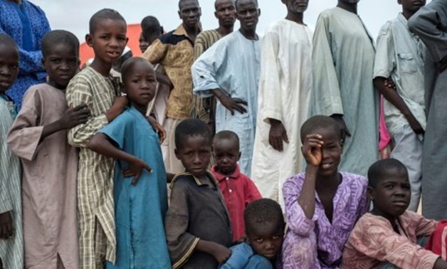© AFP | People queue to receive medical treatment at the Bakassi Internally Displaced Peoples Camp in Maiduguri, Nigeria
