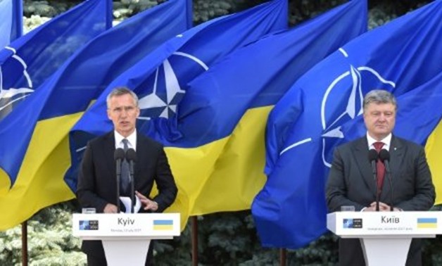 © AFP | 'Russia must withdraw it's thousands of soldiers from Ukraine and stop supporting the militants,' the NATO chief (left) said during a joint press conference with Ukrainian president Petro Poroshenko
