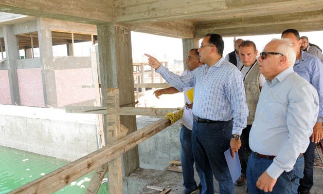 Housing Minister Mostafa Madbouly on constructing site of Port Said’s social housing project (Photo: Courtesy to Housing and Urban Communities Ministry’s official page)