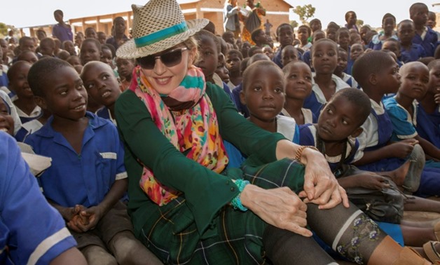 US pop star Madonna has adopted four Malawian children
