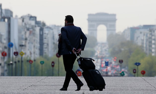 EXPENSIVE MOVE: Banks may shift some operations to Europe when Britain leaves the EU, and that could push up finance costs for European companies. Above, a businessman walking at La Defense business district near Paris, France. REUTERS/Gonzalo Fuentes
