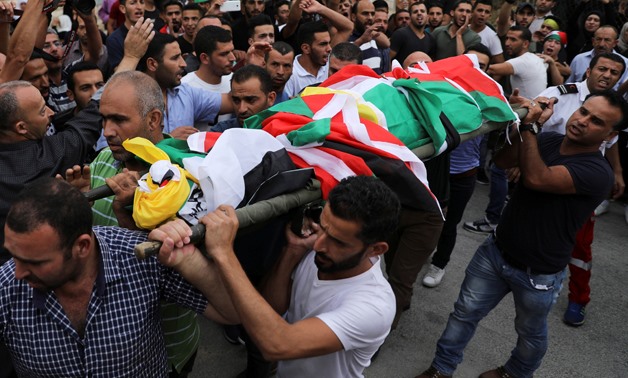Mourners carry the body of Palestinian Mohammad Jebril during his funeral in Tekoa village near Bethlehem July 11, 2017. REUTERS/Ammar Awad