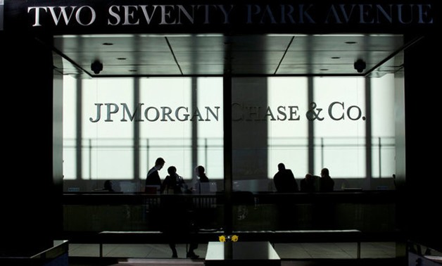 People walk inside JP Morgan headquarters in New York - Reuters